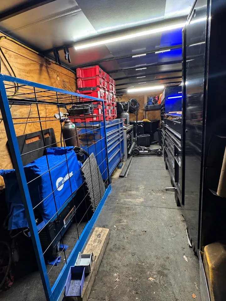 Inside the mobile service trailer with tools, welding equipment and storage